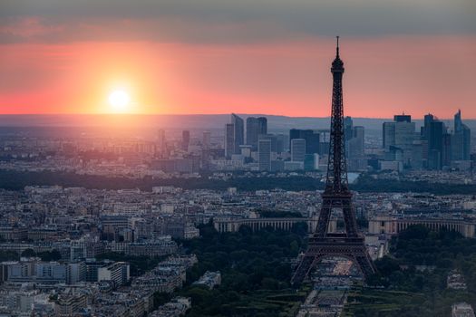 Panoramic aerial view of Paris, Eiffel Tower and La Defense business district. Aerial view of Paris at sunset. Panoramic view of Paris skyline with Eiffel Tower and La Defense. Paris, France. 