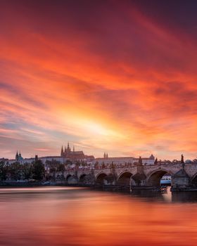 Charles Bridge in Prague in Czechia. Prague, Czech Republic. Charles Bridge (Karluv Most) and Old Town Tower. Vltava River and Charles Bridge. Concept of world travel, sightseeing and tourism.