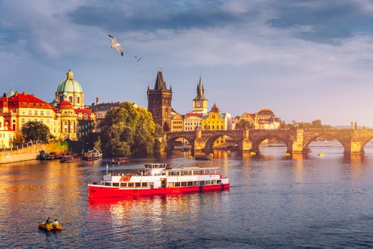 Prague Castle, Charles Bridge and boats on the Vltava river. View of Hradcany Prague Castle, Charles Bridge and a boats on the Vltava river in the capital of the Czechia. Boat cruise on Vltava river.