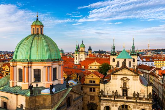 Scenic summer aerial panorama of the Old Town architecture in Prague, Czech Republic. Red roof tiles panorama of Prague old town.  Prague Old Town Square houses with traditional red roofs. Czechia.