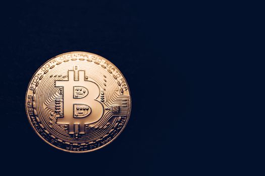 Crypto currency golden coin with bitcoin symbol on isolated on black background. Bitcoin Coin on black background. Bitcoin cryptocurrency.  Cryptocurrency Coin Concept.