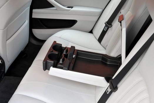 armrest in the car with can holders, rear seats