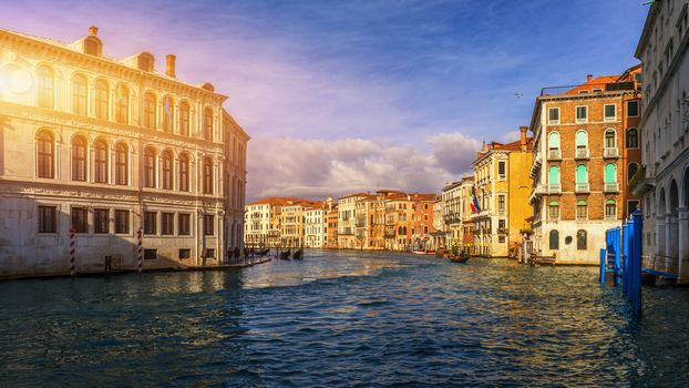 Grand Canal with gondolas in Venice, Italy. Sunset view of Venice Grand Canal. Architecture and landmarks of Venice. Venice postcard