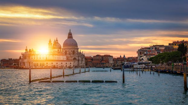 Grand Canal with gondolas in Venice, Italy. Sunset view of Venice Grand Canal. Architecture and landmarks of Venice. Venice postcard