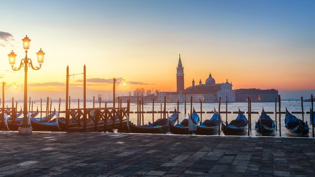 Sunrise in San Marco square, Venice, Italy. Venice Grand Canal. Architecture and landmarks of Venice. Venice postcard with Venice gondolas
