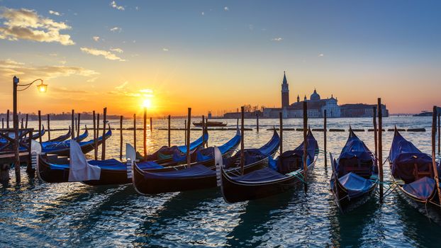 Canal with gondolas in Venice, Italy. Architecture and landmarks of Venice. Venice postcard with Venice gondolas.