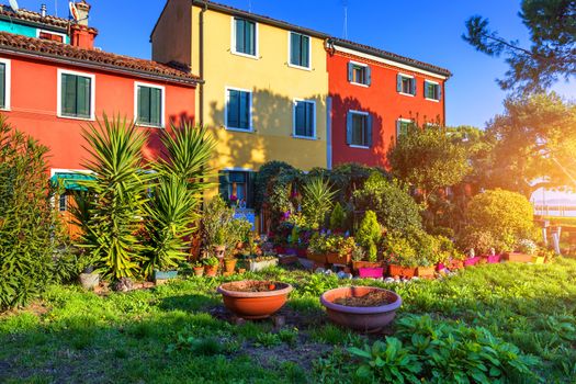 Lovely house facade and colorful walls in Burano, Venice. Burano island canal, colorful houses and boats, Venice landmark, Italy. Europe