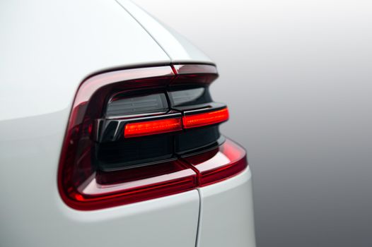 the tail lights on a luxury passenger car