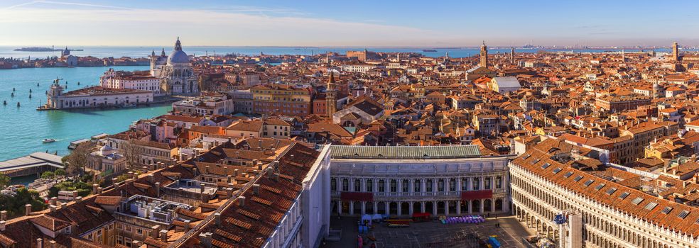Venice panoramic aerial view with red roofs, Veneto, Italy. Aerial view with dense medieval red roofs of Venice, Italy 