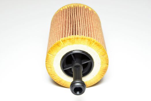car oil filter cartridge on white background
