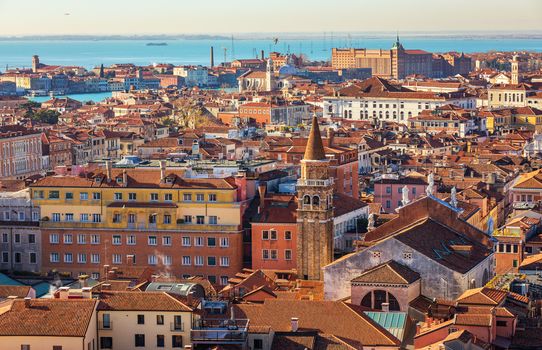 Venice panoramic aerial view with red roofs, Veneto, Italy. Aerial view with dense medieval red roofs of Venice, Italy 