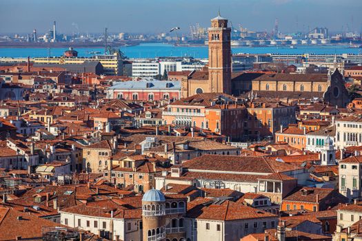 Venice panoramic aerial view with red roofs, Veneto, Italy. Aerial view with dense medieval red roofs of Venice, Italy 