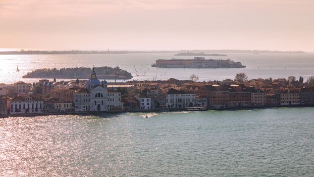 Venice panoramic aerial view with red roofs, Veneto, Italy. Aerial view with dense medieval red roofs of Venice, Italy 