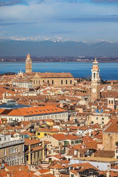 Venice panoramic aerial view with red roofs, Veneto, Italy. Aerial view of the Venice city, Italy. Venice is a popular tourist destination of Europe. Venice, Italy.