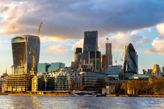 Business district with famous skyscrapers and landmarks at golden hour, London, UK