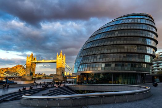 London skyline with City Hall and Tower Bridge at sunset, London, UK