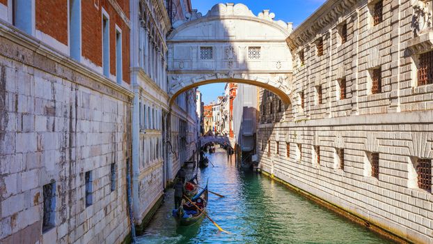 View of the Bridge of Sighs (Ponte dei Sospiri) and the Rio de Palazzo o de Canonica Canal from the Riva degli Schiavoni in Venice, Italy. The Ponte de la Canonica is visible in background.