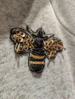 a bee sticker on a sweater