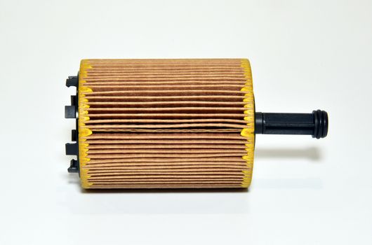 car oil filter cartridge on white background