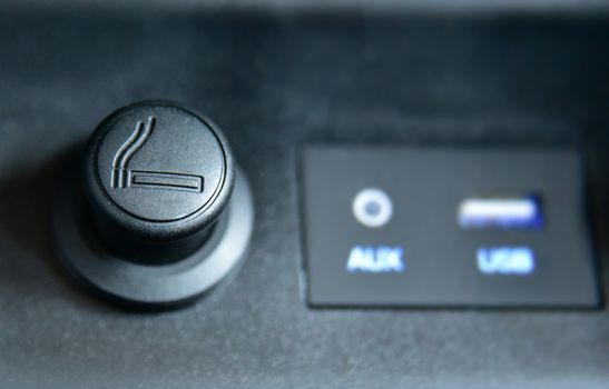 cigarette lighter on the dashboard of a passenger car