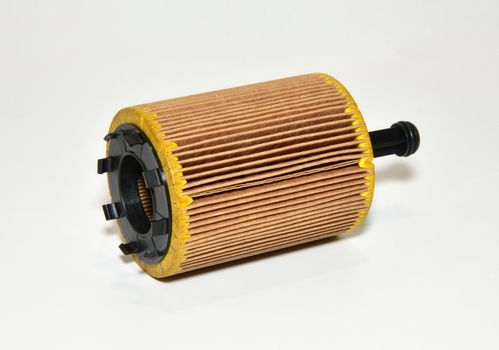 car oil filter cartridge on white background