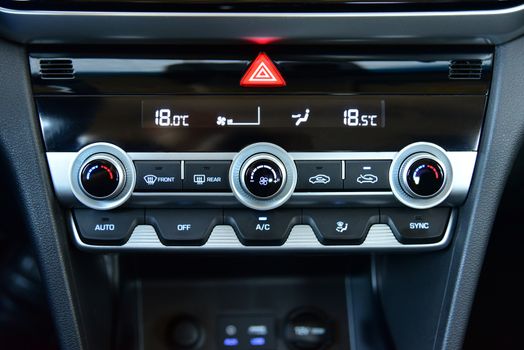 button for activating the air conditioners on the dashboard passenger car