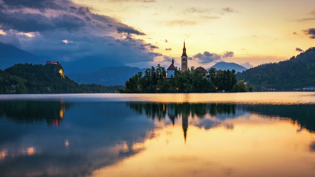Lake Bled Slovenia. Beautiful mountain Bled lake with small Pilgrimage Church. Most famous Slovenian lake and island Bled with Pilgrimage Church of the Assumption of Maria. Bled, Slovenia.