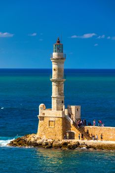 Panorama of venetian harbour waterfront and lighthouse in old harbour of Chania, Crete, Greece. Old venetian lighthouse in Chania, Greece. Lighthouse of the old Venetian port in Chania, Greece.