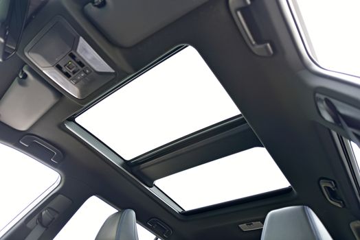 photo large sunroof inside car, sky and clouds
