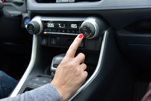 buttons for activating the air conditioners on the dashboard passenger car