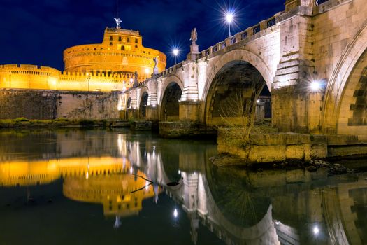 The Mausoleum of Hadrian, usually known as the Castle of the Holy Angel (Castel Sant Angelo) and Ponte Sant'Angelo bridge, a towering cylindrical building in Parco Adriano, Rome, Italy
