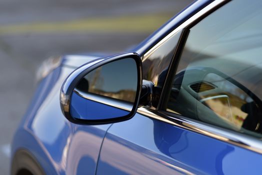 Car detail, Side mirror with turn signal of a luxury car