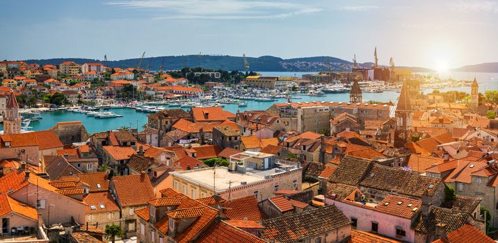 Trogir in Croatia, town panoramic view with red roof tiles, Croatian tourist destination. Trogir town sea front view, Croatia. Roofs of Trogir in Croatia.