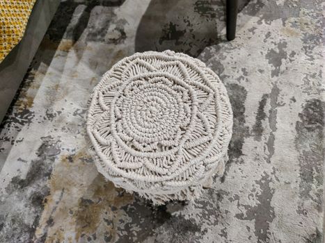 a white decoration on a carpet.