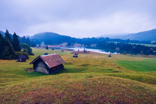 View from flying drone. Astonishing evening view of Wagenbruchsee (Geroldsee) lake with Westliche Karwendelspitze mountain range on background, Bavarian Alps, Germany, Europe.