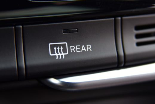 Close-up to the rear window heater, the electric part of the car