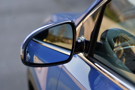 Car detail, Side mirror with turn signal of a luxury car