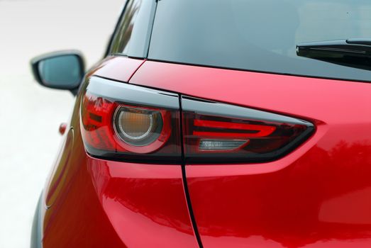 the tail lights on a luxury passenger car