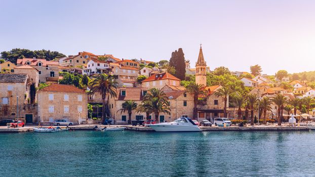 Fishing boats in Splitska village with beautiful port, Brac island, Croatia. Village of Splitska on Brac island seafront view, Dalmatia, Croatia, Croatia.