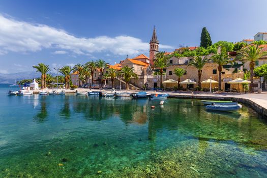 Fishing boats in Splitska village with beautiful port, Brac island, Croatia. Village of Splitska on Brac island seafront view, Dalmatia, Croatia, Croatia.