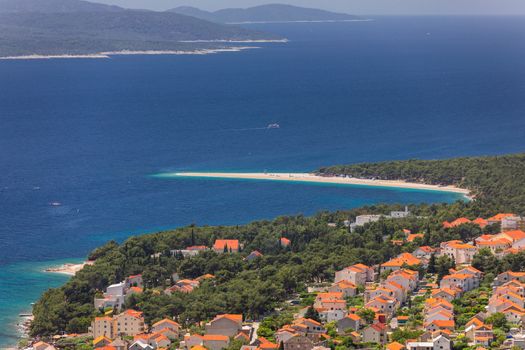 Zlatni Rat (Golden Cape or Golden Horn) famous turquoise beach in Bol town on Brac island, Dalmatia, Croatia. Zlatni Rat sandy beach at Bol on Brac island of Croatia in summertime.