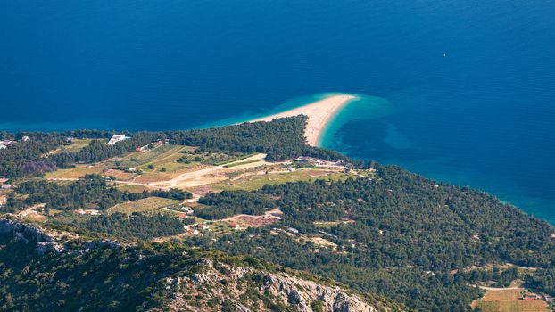 Zlatni Rat (Golden Cape or Golden Horn) famous turquoise beach in Bol town on Brac island, Dalmatia, Croatia. Zlatni Rat sandy beach at Bol on Brac island of Croatia in summertime.