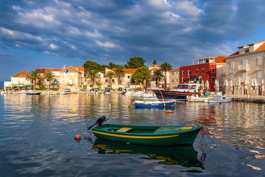 Fishing boat anchoring in beautiful Sutivan port, Brac island, Croatia. Sutivan on Island Brac in Croatia. Made of well known white limestone. Port with fishing boats. Sutivan, Brac, Croatia.