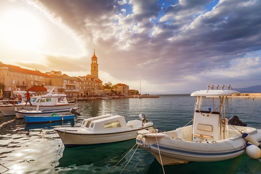 Fishing boat anchoring in beautiful Sutivan port, Brac island, Croatia. Sutivan on Island Brac in Croatia. Made of well known white limestone. Port with fishing boats. Sutivan, Brac, Croatia.