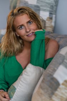 A gorgeous blonde model enjoys a day at home before work
