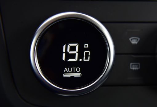 buttons for activating the air conditioners on the dashboard passenger car