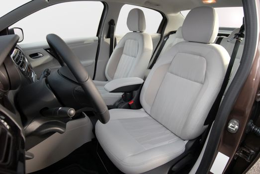 interior of a modern car with white seats