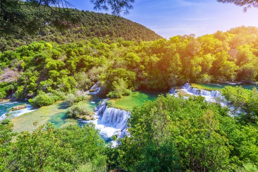 Waterfalls Krka, National Park, Dalmatia, Croatia. View of Krka National Park, Roski Slap location, Croatia, Europe. Beautiful world of Mediterranean countries. Traveling concept background.