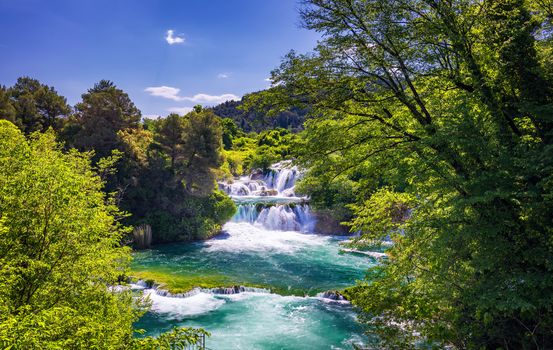 Waterfalls Krka, National Park, Dalmatia, Croatia. View of Krka National Park, Roski Slap location, Croatia, Europe. Beautiful world of Mediterranean countries. Traveling concept background.