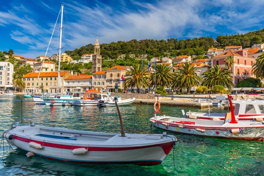 View at amazing archipelago with boats in front of town Hvar, Croatia. Harbor of old Adriatic island town Hvar. Popular touristic destination of Croatia. Amazing Hvar city on Hvar island, Croatia. 
